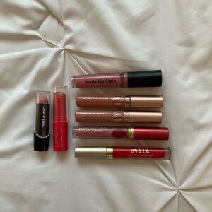 Bundle of pink, mauve and red lipsticks and liquid lipsticks